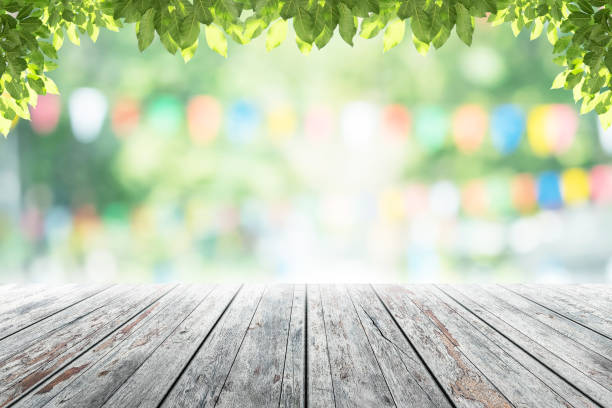 istock Empty wooden table with party in garden background blurred. 641622150