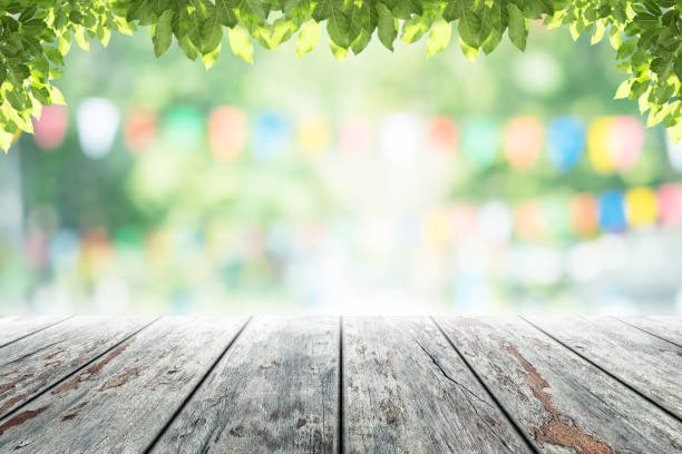 istock Empty wooden table with party in garden background blurred. 641622312