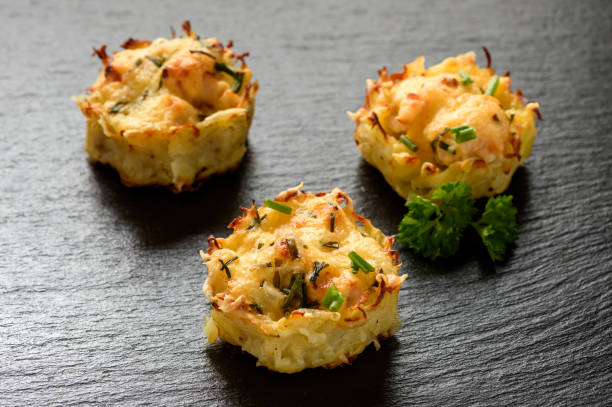 istock Appetizer - potato muffins with chicken meat and cheese. 641623414