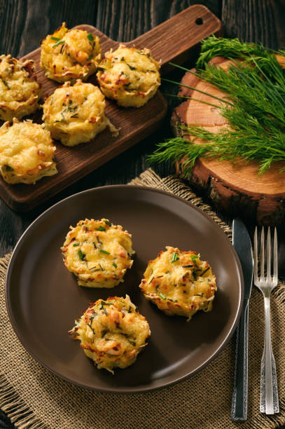 istock Appetizer - potato muffins with chicken meat and cheese. 641623508