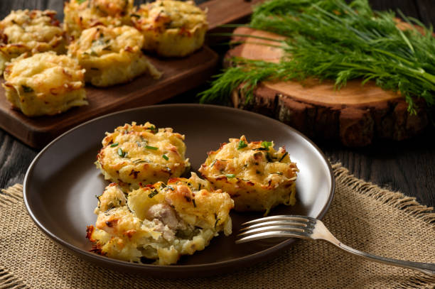 istock Appetizer - potato muffins with chicken meat and cheese. 641623542