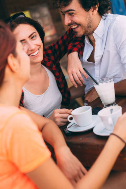 istock Three friends at a beach bar 641624396