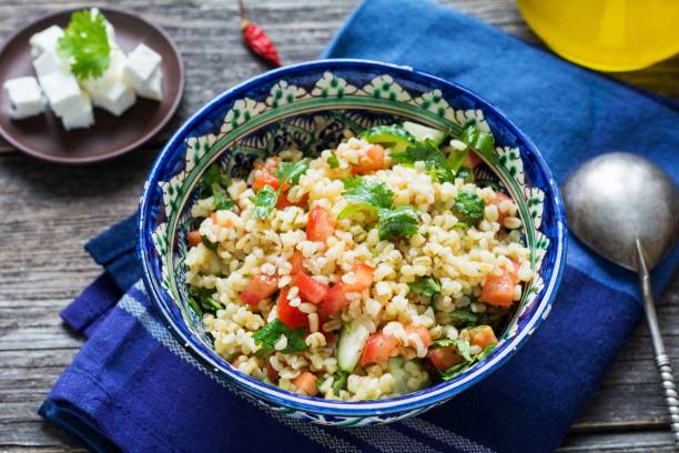 istock Tabbouleh, healthy salad with bulgur and vegetables 641625048