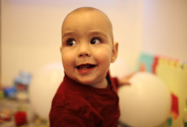 istock Baby boy playing with toys 641625372