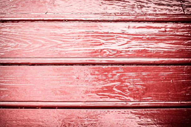istock Natural wood plank background texture painted with vibrant red 641628690
