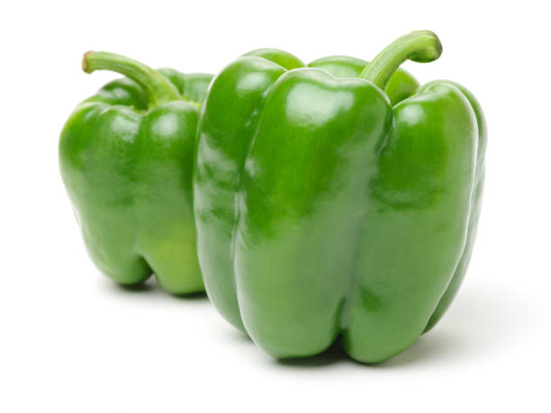 istock Isolated green capsicum couple  on white background 641629316