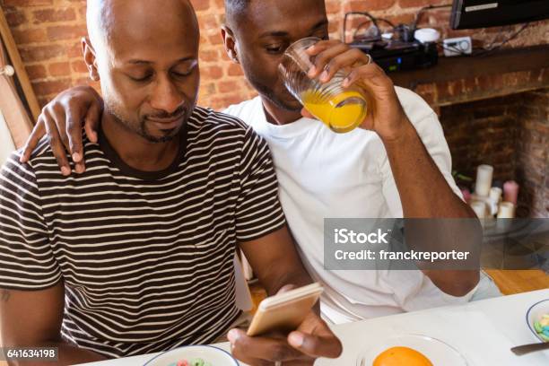 gay couple doing the breakfast and take a pic