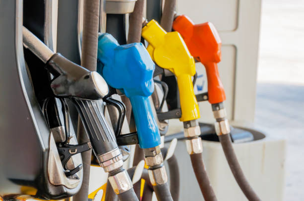 istock Gas pump nozzles in a service station 641637684