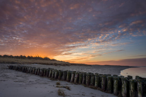 istock Groyne at sand beach under romantic sky 641637718