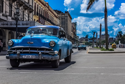 American blue Chevrolet classic car drived on the mainstreet in Havana Cuba - Serie Cuba Reportage