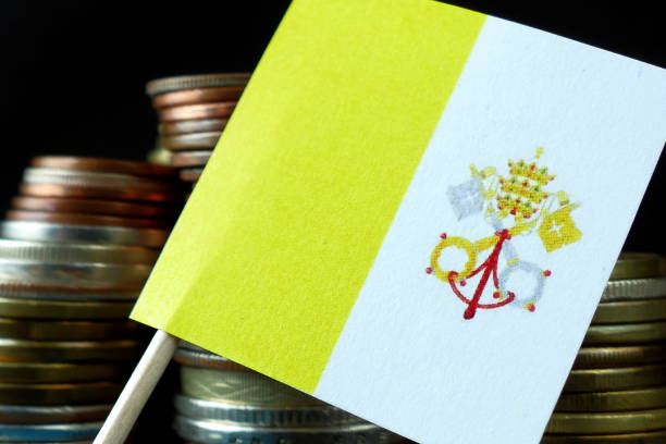 Vatican City flag waving with stack of money coins macro stock photo
