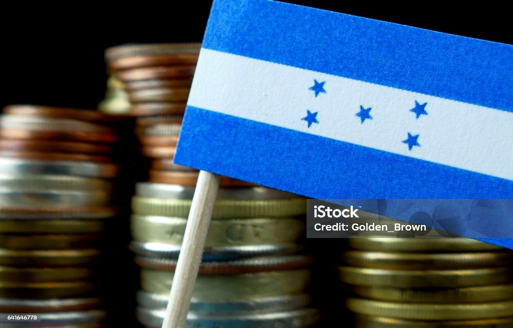 Honduras flag waving with stack of money coins macro Advice Stock Photo