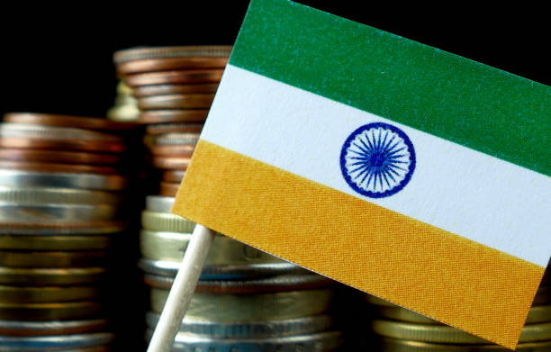 istock India flag waving with stack of money coins macro 641647486