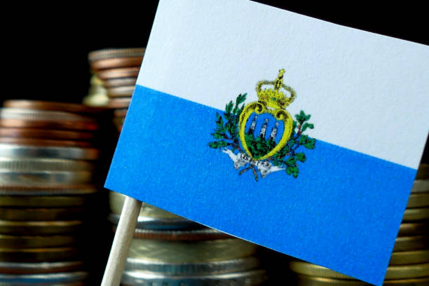 istock San Marino flag waving with stack of money coins macro 641647886