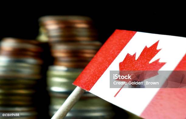 Canada Flag Waving With Stack Of Money Coins Macro Stock Photo - Download Image Now - Canada, Bank - Financial Building, Banking