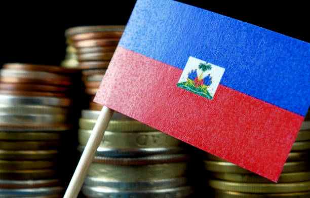 istock Haiti flag waving with stack of money coins macro 641650502