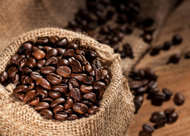 istock Coffee beans on wooden background 641652332
