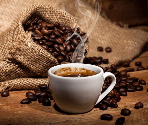 istock Coffee beans on wooden background 641652356