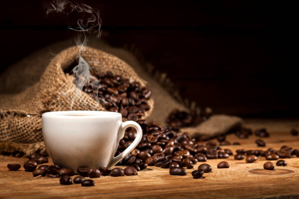 istock Coffee beans on wooden background 641652364