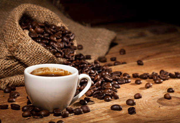 istock Coffee beans on wooden background 641652370