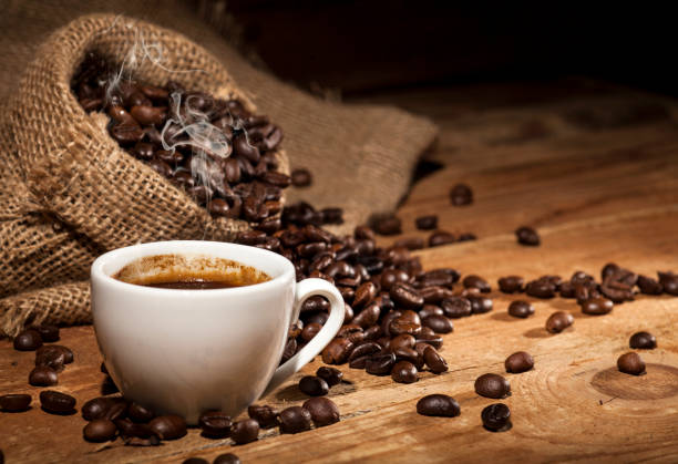 istock Coffee beans on wooden background 641652472