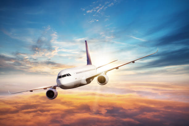 istock Huge airplane flying above clouds in dramatic sunset 641659646