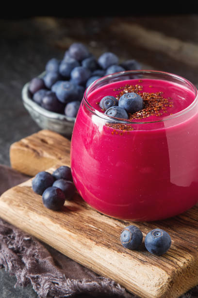istock Fresh homemade smoothie with quinoa and berries. Dark background. 641665542