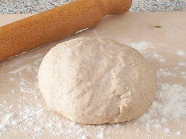Cooking process. Preparing fresh dough for cakes, pastries, buns or pizza. stock photo