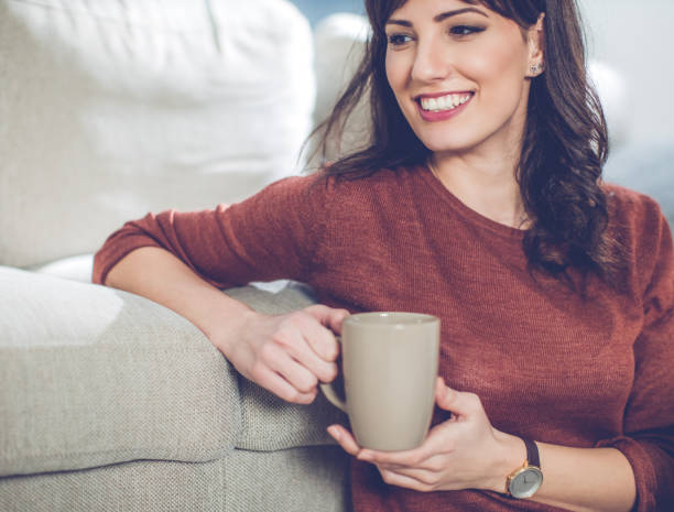istock Serene woman relaxing at home and drinking coffee 641667704