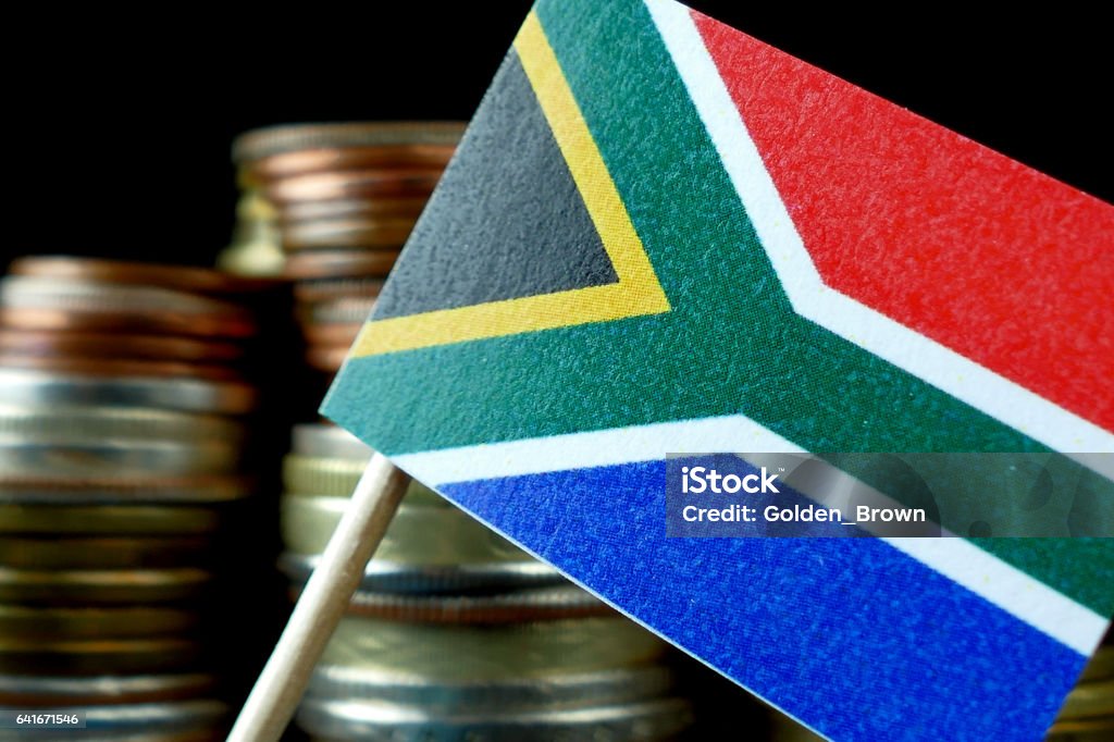 South Africa flag waving with stack of money coins macro Currency Stock Photo