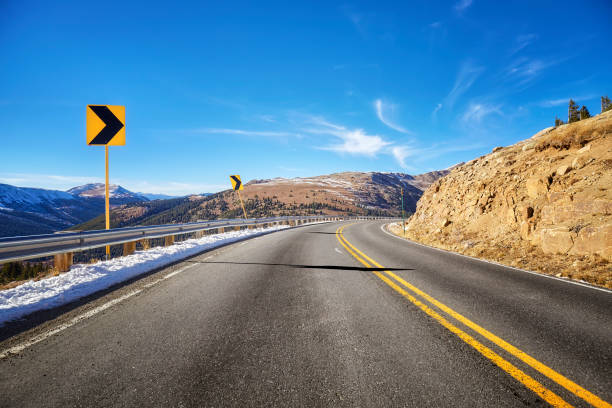 istock Mountain asphalt road turn, travel warning concept picture. 641673376