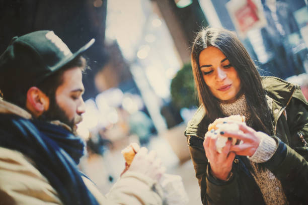 istock Couple eating on the street 641674354