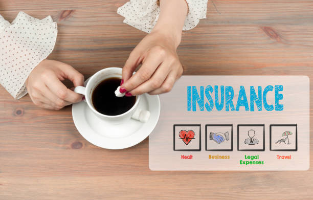 istock Insurance. Coffee cup top view on wooden table background 641674624