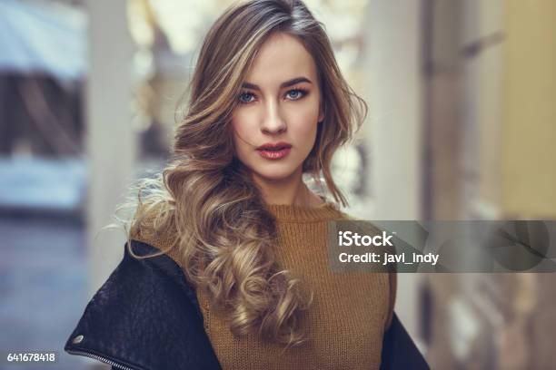 Blonde Woman In Urban Background Stock Photo - Download Image Now - Women, Fashion Model, Winter
