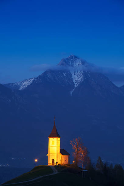 Lonely church on the hill at sunset at Jamnik, Slovenia