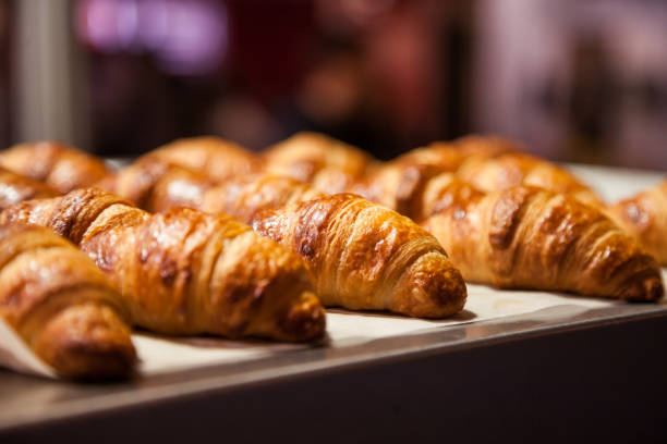 French Boulangerie - fresh croissant for sale Rows of fresh baked French croissants ready to be sold bread bakery baguette french culture stock pictures, royalty-free photos & images