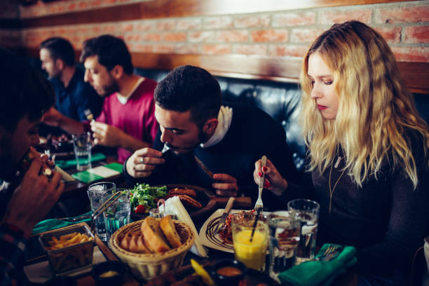 istock Friends eating in restaurant 641681486