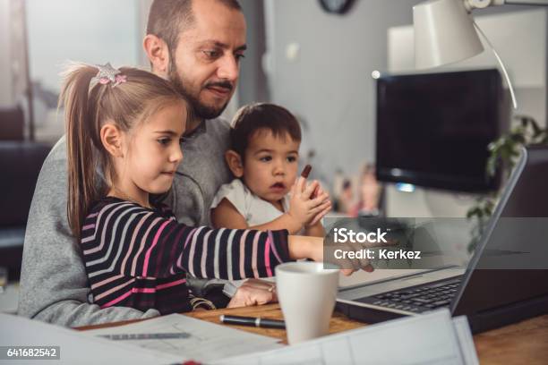 Father With Daughter And Son On His Lap Stock Photo - Download Image Now - Beard, Child, Daughter