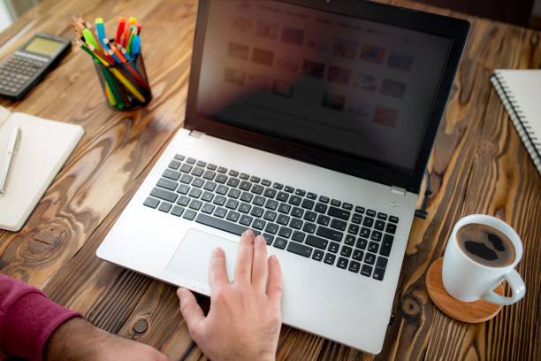 istock Hands Working On Laptop On Rustic Wooden Table In Office 641683716
