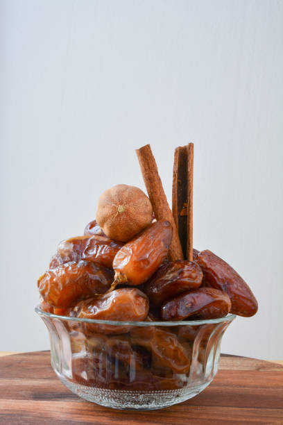 Glass bowl full of dates