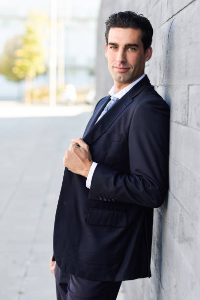 istock Young handsome businessman, dressed in blue suit, 641684306