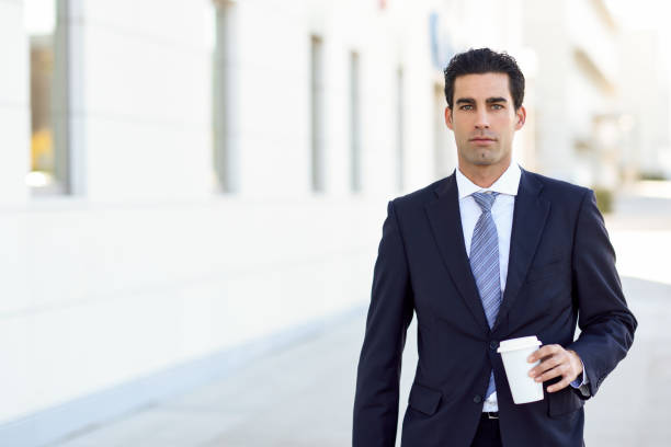 istock Businessman with formal clothes drinking coffee 641684344