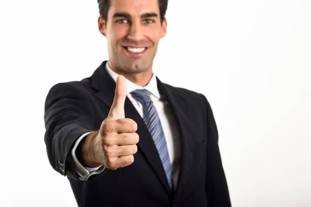 istock Businessman with thumb up wearing blue suit and tie 641684486