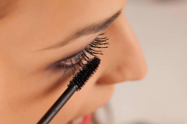 istock young woman applied mascara to her lashes 641684718