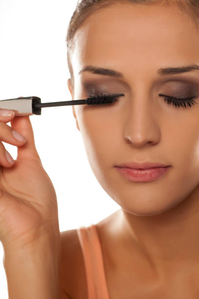 istock young woman applied mascara to her lashes 641684728