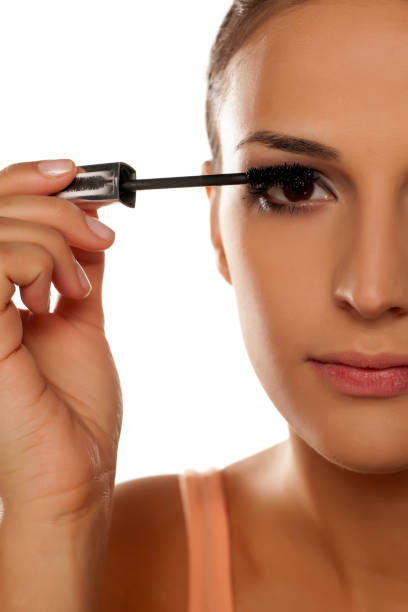istock young woman applied mascara to her lashes 641685014