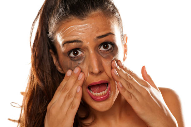 istock Young beautiful women applied a cream to remove her makeup 641685062