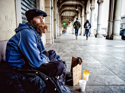 Homeless man on begging on the street. About 45 years old, Caucasian male.