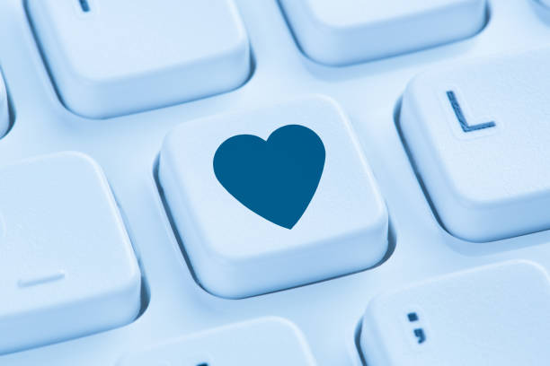 istock Searching partner love online internet dating heart blue computer keyboard 641689182
