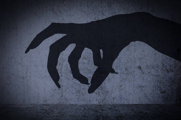 istock Afraid of a big monster claw shadow 641689184